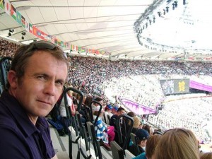 Man and crowds inside the Olympic stadium